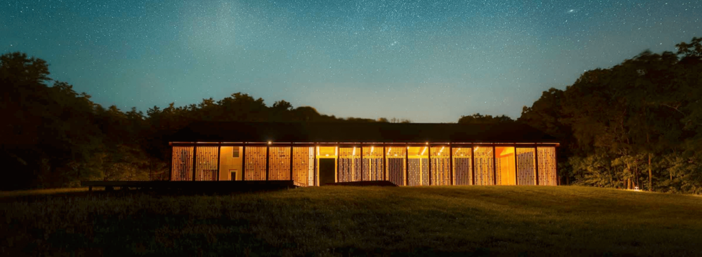 Beautifully lit Open Air Pavilion reception space under the stars. 